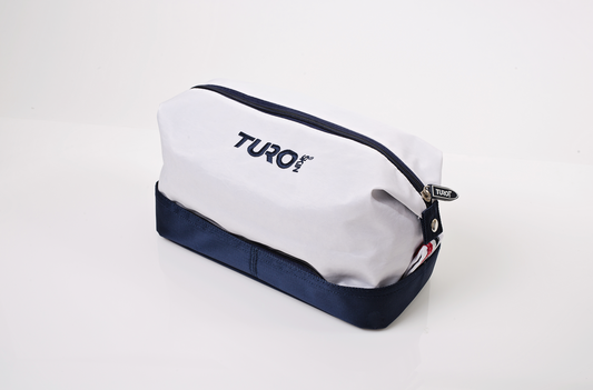 TuroSkin white and blue dopp kit travel toiletry bag with durable sailcloth design.